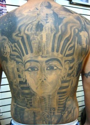 the hots for that tattoo on the small of her back, an Egyptian symbol of